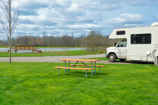 RV (camper) in camping, family vacation travel, holiday trip in motorhome
