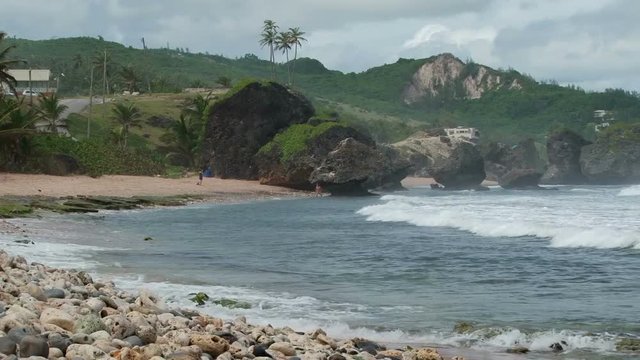 Waves crashing on the Bathsheba beach with boulders on the background on east coast of Barbados