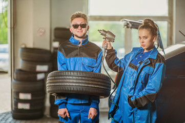 Man and woman in auto mechanics