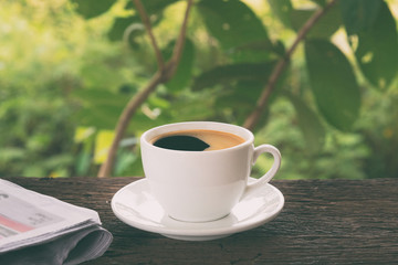 A cup of coffee and a newspaper