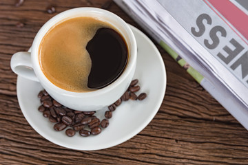 A cup of coffee and a newspaper