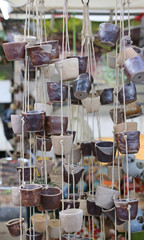 Empty small ceramic pot hanging for decoration in the garden.