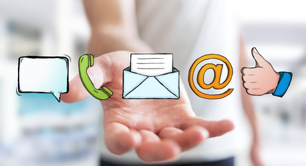 Businessman holding manuscript contact icon in his hand