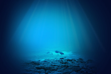 Deep blue sea background with sunlight shining 

