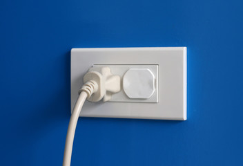 plugged into white outlet.