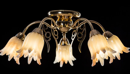 Chandelier light in interior on black background