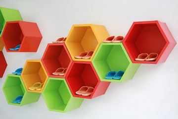 Colorful Modern Shoe Rack on the white wall.
