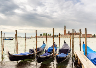 Obraz na płótnie Canvas gondolas and San Giorgio Maggiore island in the background, Venice, italy