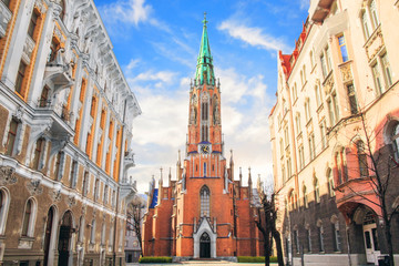 Church of St. Gertrude on the streets of Riga, Latvia on a sunny day - obrazy, fototapety, plakaty
