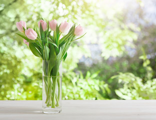Flowers background, pink tulips at garden background, copy space