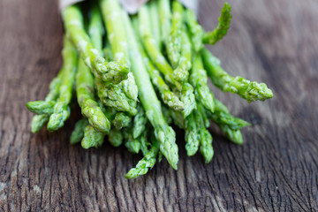 Asparagus. Raw asparagus. Fresh Asparagus.Green Asparagus on wooden background