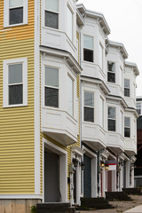 Townhomes with garages and large bay windows