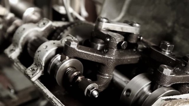 Close-up of industrial moving steel gears