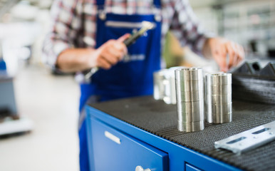 Bearings in industry factory with worker in background