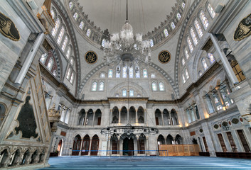 Fototapeta premium Interior of Nuruosmaniye Mosque, an Ottoman Baroque style mosque completed in 1755, with a huge dome & many colored stained glass windows located in Shemberlitash, Fatih, Istanbul, Turkey