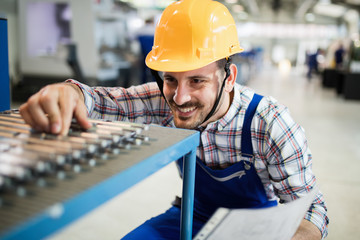 Supervisor doing quality control and pruduction check in factory