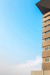 The tall building and blue sky.