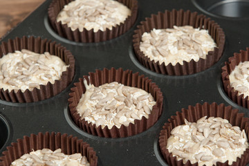 Raw Superfood Muffins With Chia Seeds, Banana, Honey, Coconut, Oats In Baking Tray.