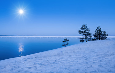 Seascape with moonlight at winter time in Finland