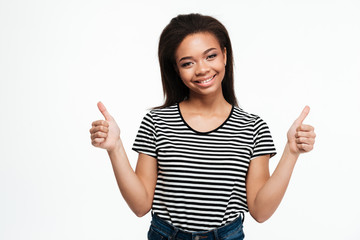 Cheerful young african lady showing thumbs up