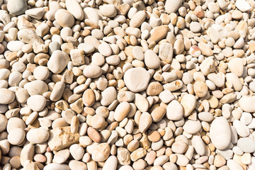 Beige decorative stones on the beach