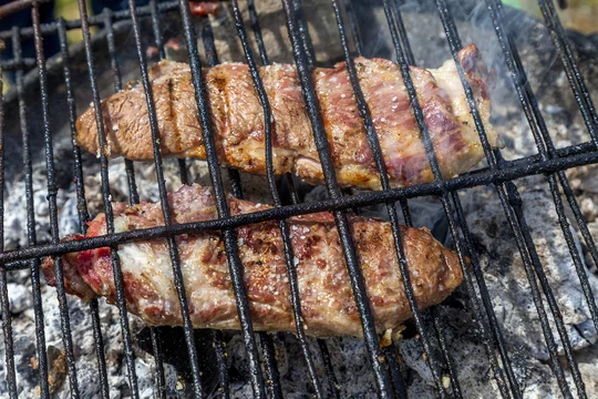 Iberian pork meat grilling on the barbecue - Secreto y Pluma iberico Stock  Photo | Adobe Stock