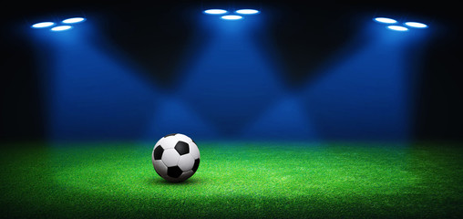 Soccer ball on green stadium