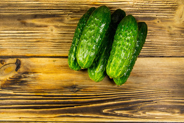 Fresh cucumbers on wooden table