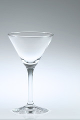 Blank glass of martini on white background