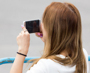 Girl with a cell phone in her hand