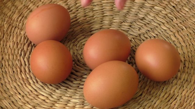 Fresh brown egg in a basket, chicken egg
