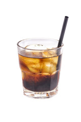 Close up of glass with iced alcohol cocktail with whisky and cola.