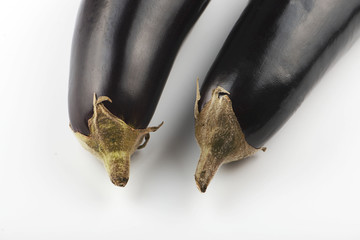 Close-up of two aubergines on white background. Isolated.