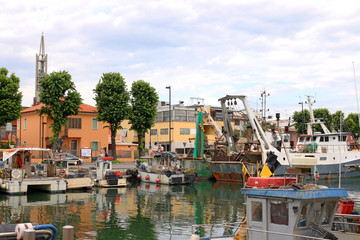 Fototapeta na wymiar fishing boats in port Rimini Italy summer season