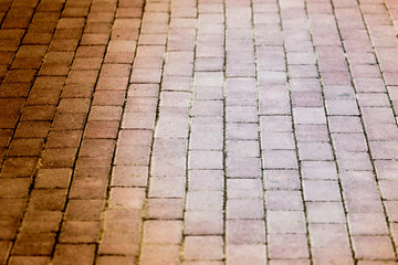 Road from a stone blocks as a background
