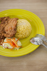 Delicious chicken cutlet served with rice.