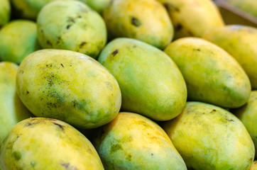 selective focus shot,fresh mangoes in the market