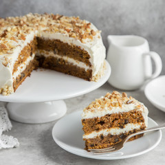 homemade carrot cake with cream cheese frosting and nuts