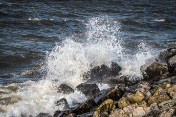 Stone coastline of the sea during strong waves