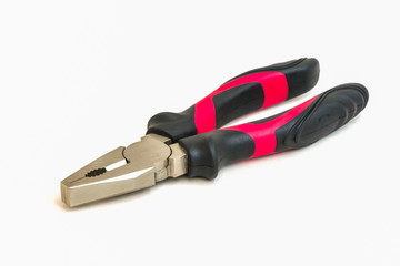 Black and red metal pliers isolated on white