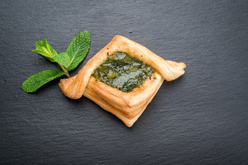 Fresh fruit tart with berries jam , mint on wooden background. Desert.