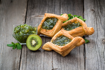 Fresh fruit tart with berries jam , mint on wooden background. Desert.