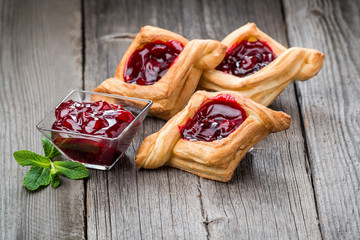 Fresh fruit tart with berries jam , mint on wooden background. Desert.