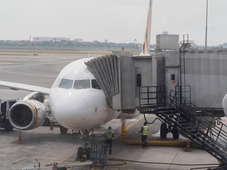 Passenger wide-body plane on the airport runaway close up