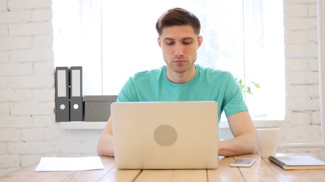 Young Man Working On Laptop, Typing