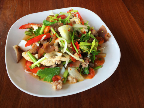 Spicy mix seafood and vegetable in white plate