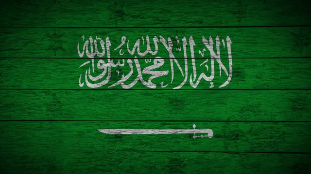Painting flag of Saudi Arabia on old wood boards