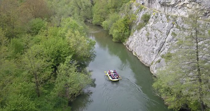 Boat rafting on river. Aerial view from a drone in Nera's Gorges, Romania (Cheile Nerei National Park)