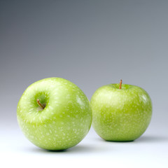 Green apples on a white background