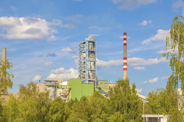 Obraz premium View of a cement plant with blue sky